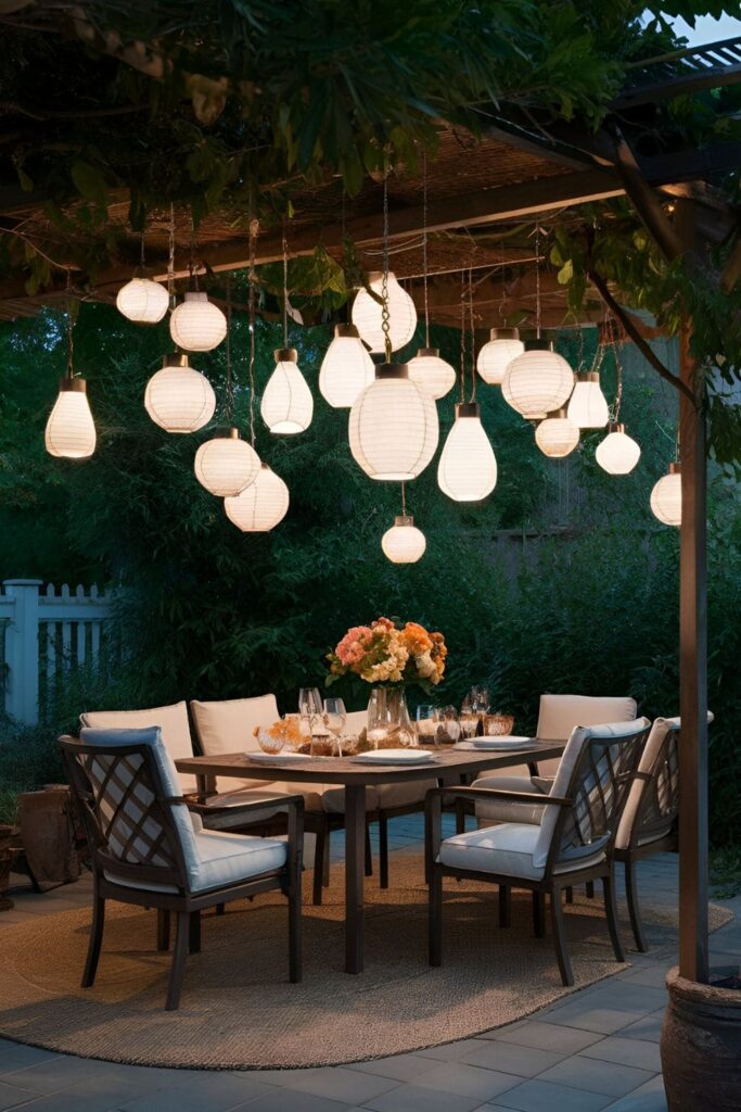 Hanging lanterns, either battery-operated or solar-powered, suspended from trees, pergolas, or hooks, casting soft, ambient lighting over a cozy patio