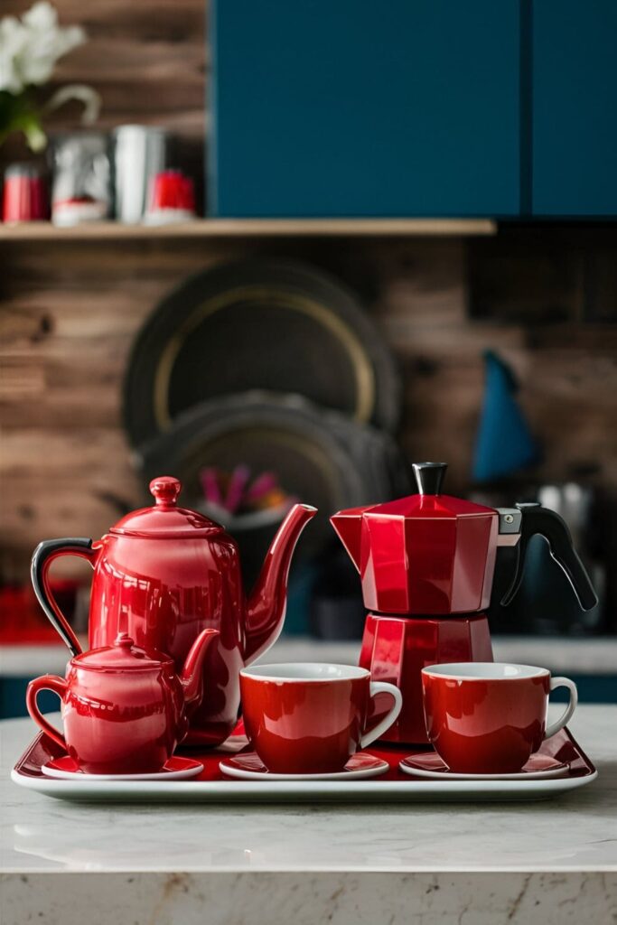 Kitchen countertop displaying vintage-style red teapots and modern red coffee pots, with matching red cups