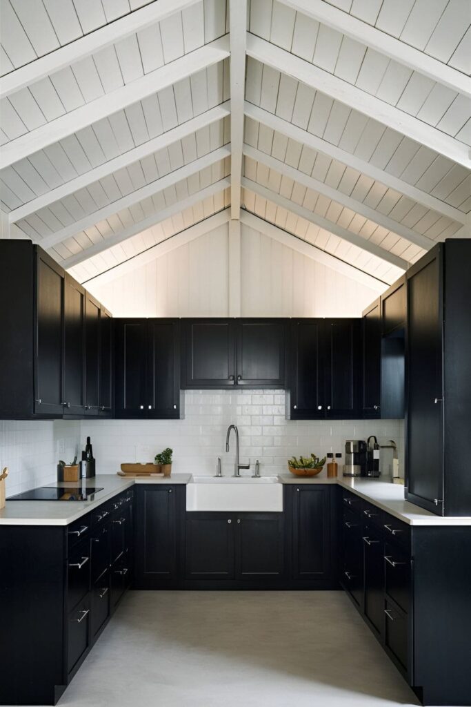 Kitchen with dark cabinets and a light-colored ceiling. The white ceiling reflects light, creating an airy and open atmosphere that feels inviting