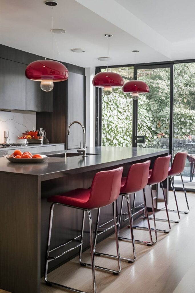 Modern kitchen with a sleek kitchen island and red bar stools with chrome legs