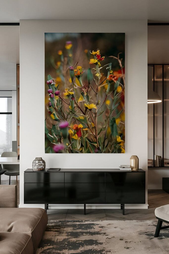 Modern living room with large botanical print of wildflowers above a black sideboard