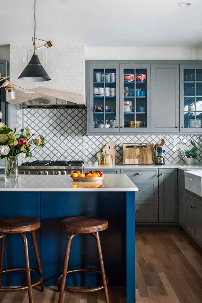 Vibrant kitchen with grey cabinets and a contrasting navy blue kitchen island, creating a bold focal point