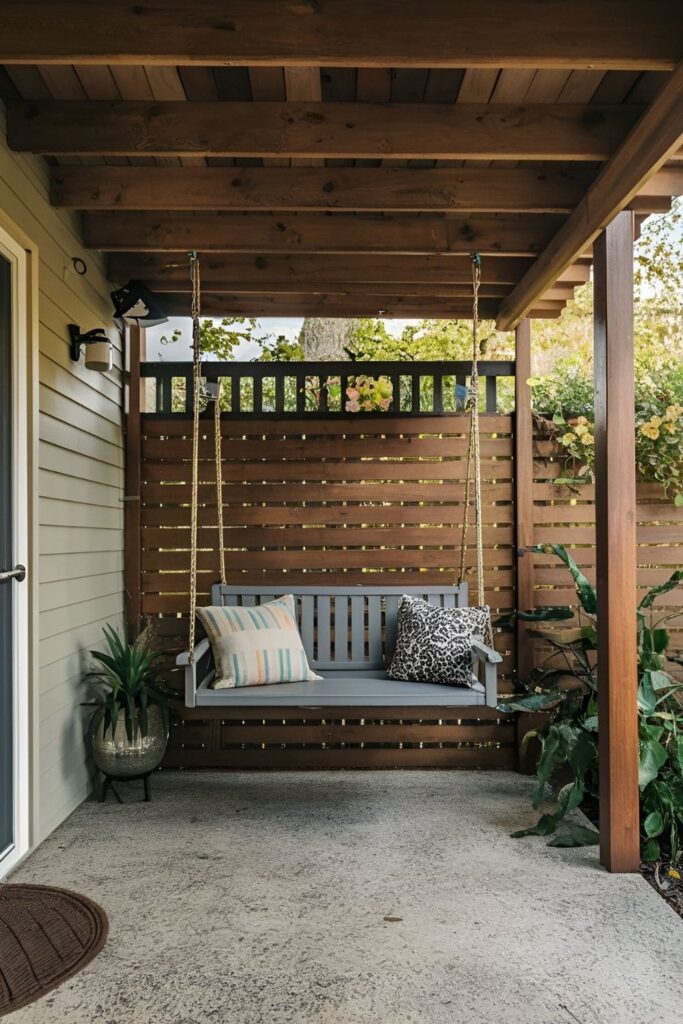 A playful small patio featuring a securely installed bench swing, providing a relaxing spot to sit and enjoy the outdoor space