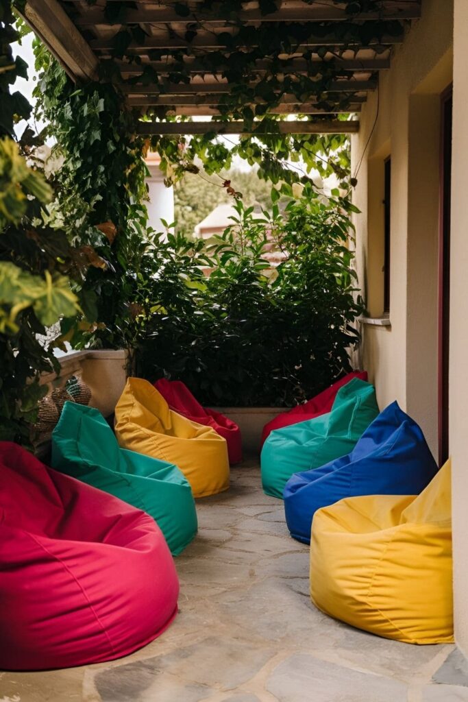 A small patio with colorful outdoor bean bags arranged for versatile seating, perfect for lounging and entertaining