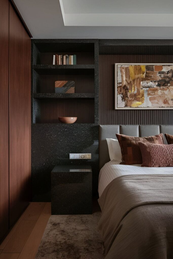 Bedroom with luxurious dark stone accents such as granite bedside tables and slate shelves, providing a natural, earthy balance to rich textures and dark colors