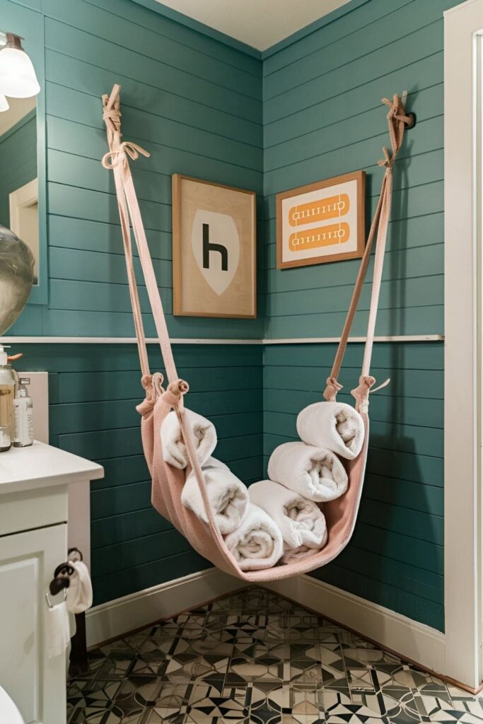 Playful bathroom corner with a towel hammock filled with rolled towels