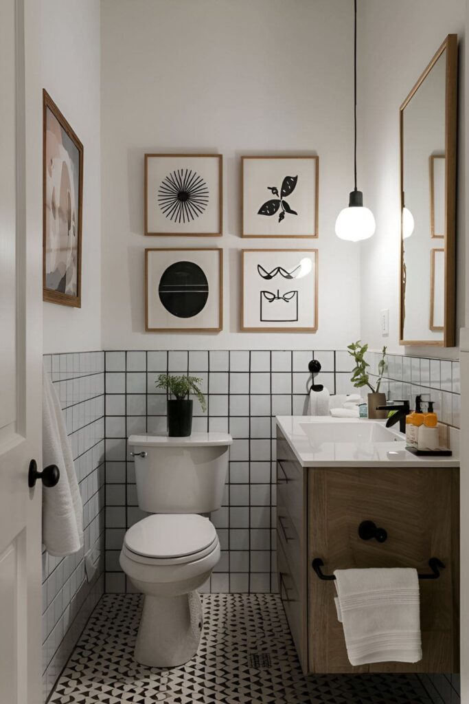 Simple, minimalist wall art pieces hanging in a small bathroom, adding personality