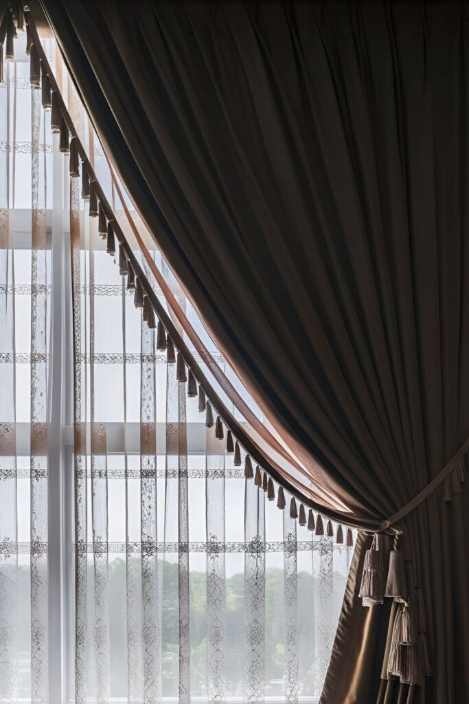 Windows with layered curtains, combining sheer and heavy drapes, creating depth and texture while controlling light and privacy