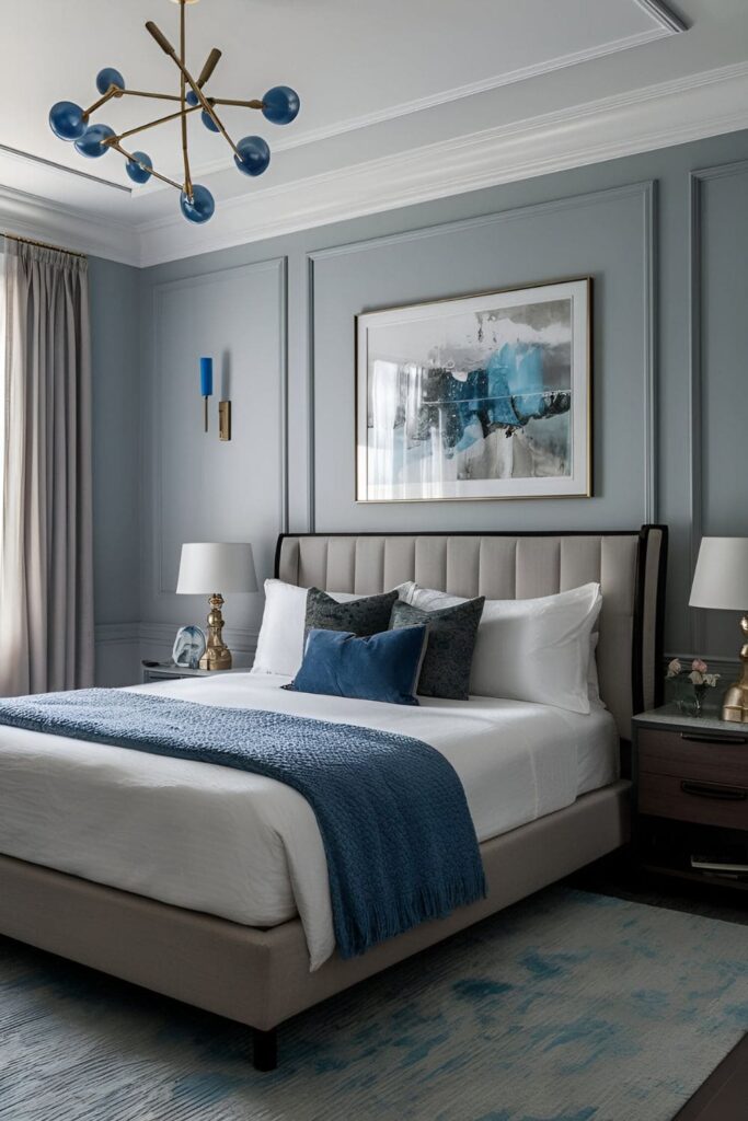 A bedroom with cool gray walls, modern furniture, and blue accents, promoting sophistication and tranquility