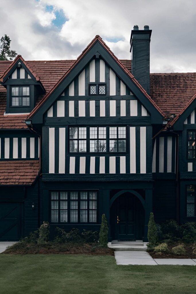 A Tudor-style home with black stucco and dark timber accents for a modern twist