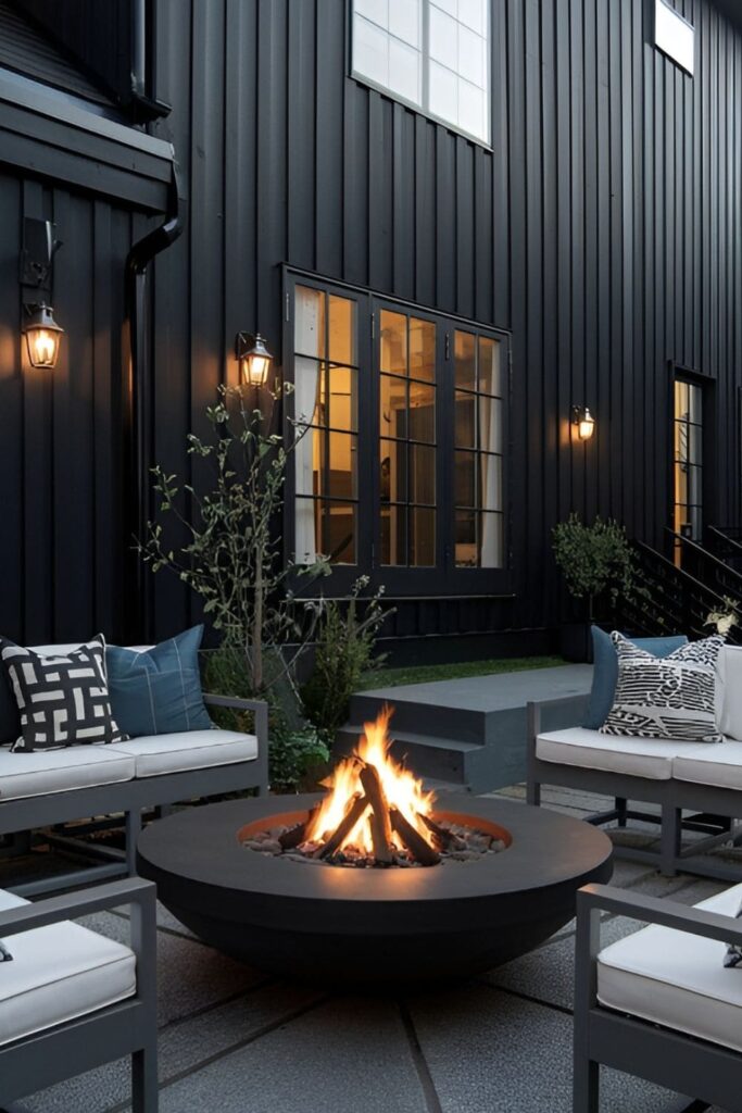 A black house with a firepit