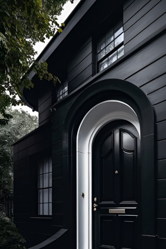 A black house with elegant arched doorways for a sophisticated touch