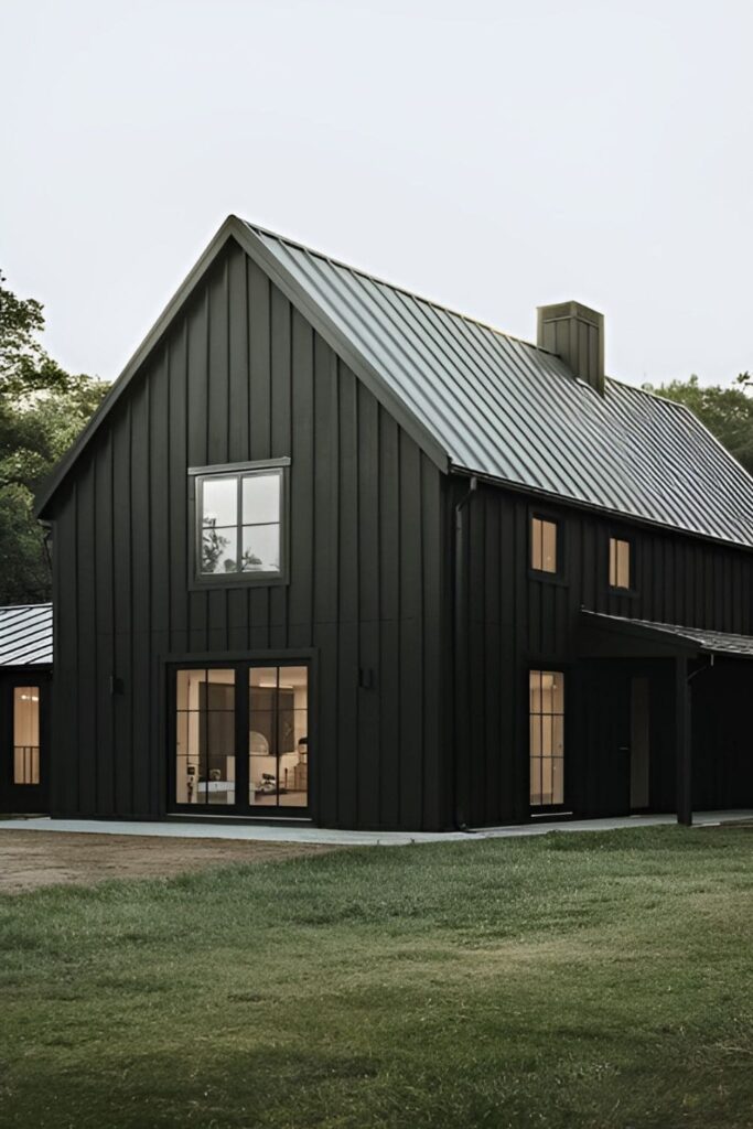 A black-painted modern farmhouse blending traditional and contemporary styles