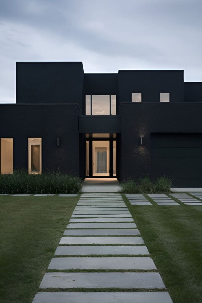 A black stucco house with clean lines and a modern, moody aesthetic