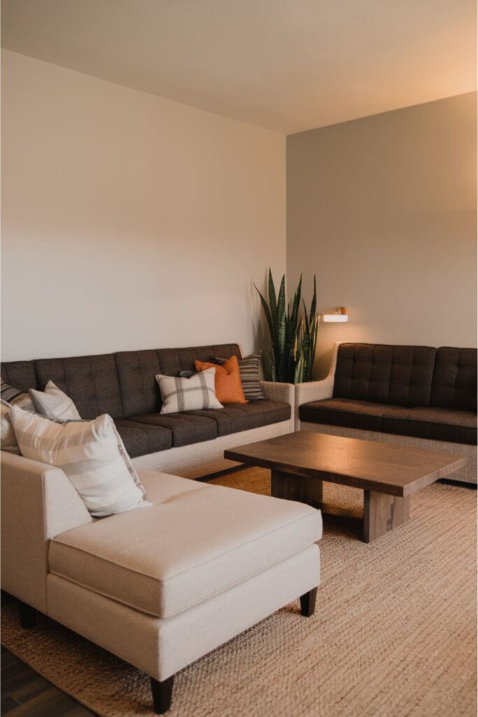 Inviting living room featuring bench seating alongside the sectional for additional flexibility and casual relaxation options