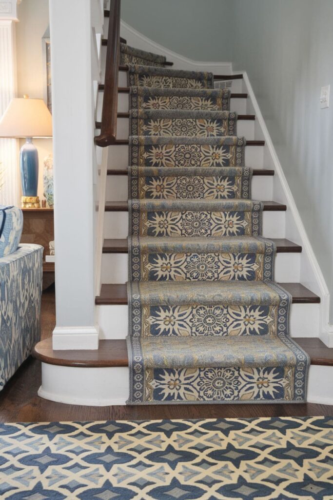 Staircase adorned with patterned stair runners or decorative tiles on the risers, adding character to the living room design