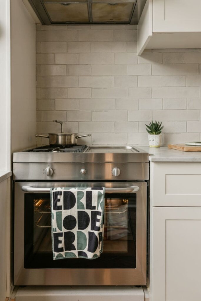Colorful kitchen towel hanging on an oven handle, adding a decorative touch to the kitchen