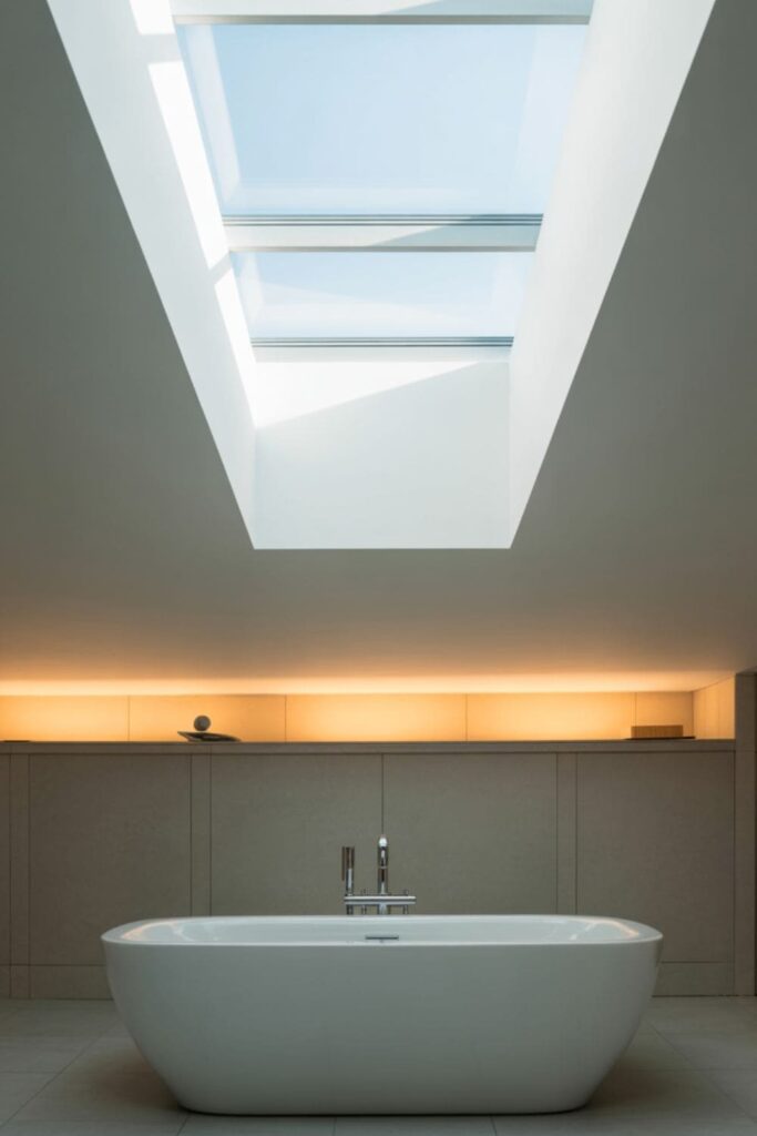 Serene bathroom with a skylight above a tub, filling the room with natural sunlight