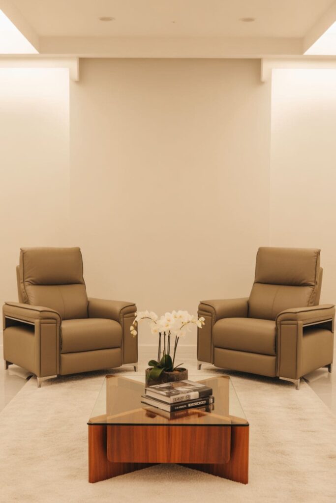 Large living room with two matching recliners symmetrically placed, neutral decor, and balanced layout