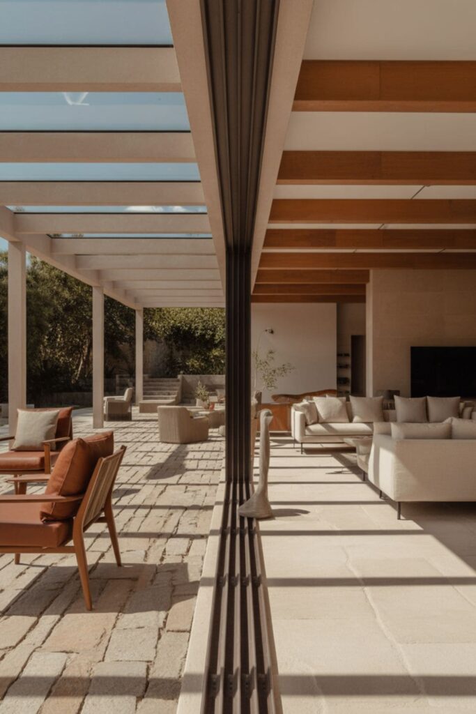 Living room with large windows creating a seamless indoor-outdoor design flow