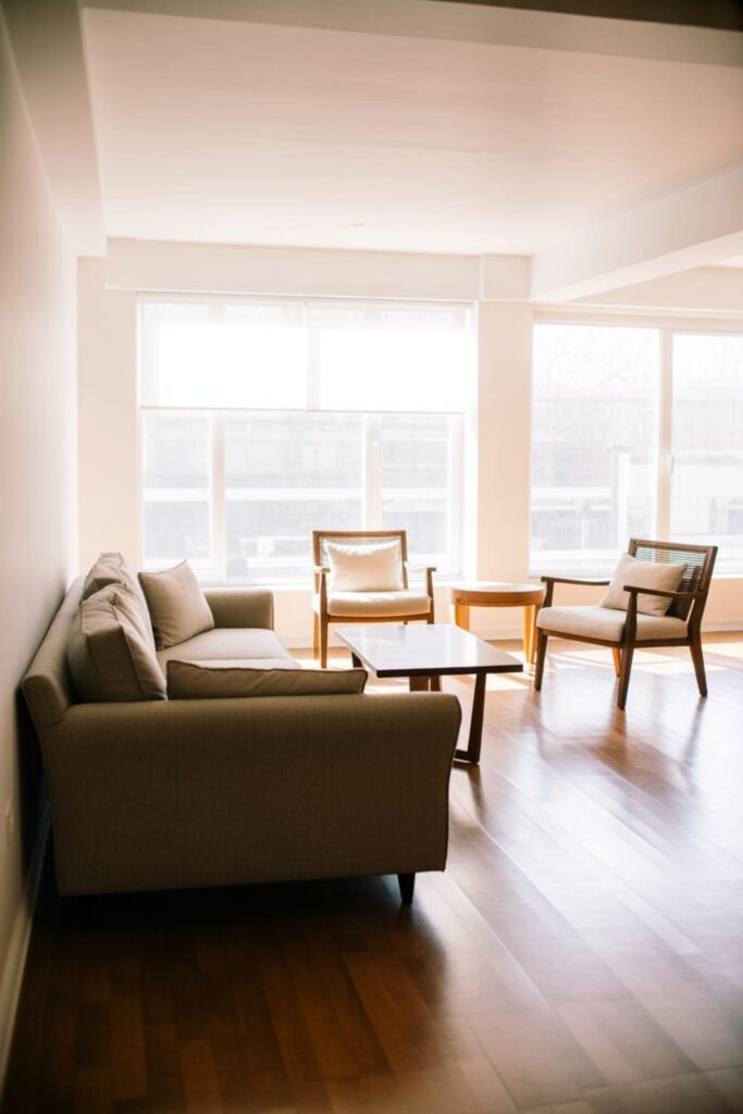 Rearranged furniture layout improving flow in a rental living room