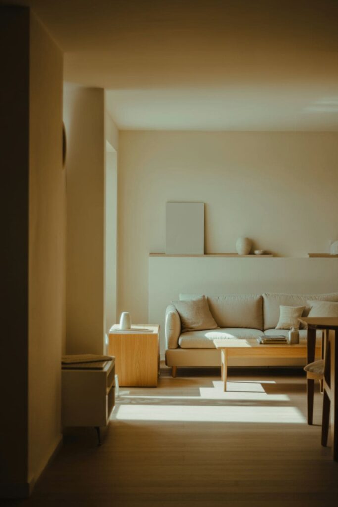 Warm ivory walls in a north-facing living room with soft natural light and cozy decor