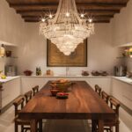 Luxurious kitchen with chandelier and wall decor visible