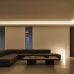 Minimal living room with ceiling cove lighting creating a soft ambient glow